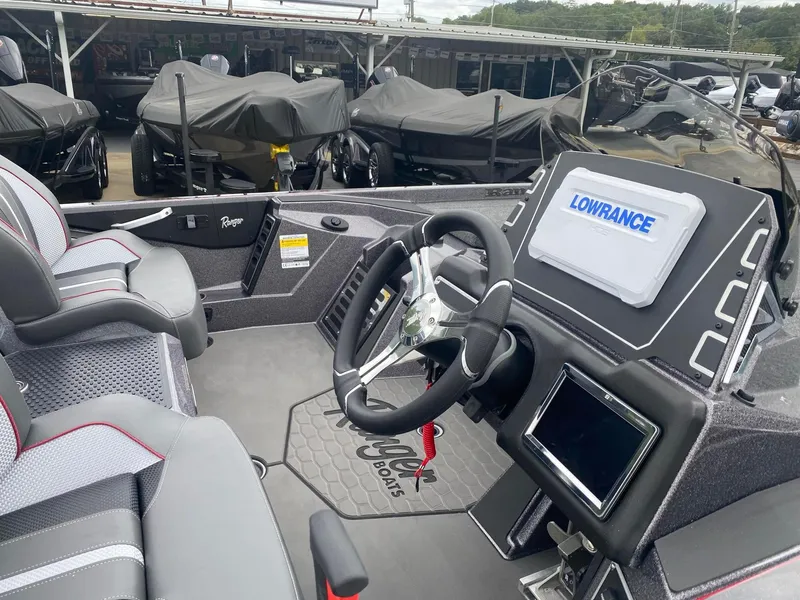 Slide: The Image of 2025 Ranger Z519R boat interior with steering wheel and Lowrance navigation system. - 7