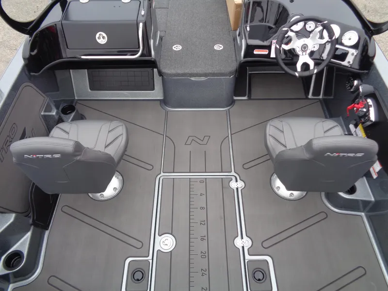 Slide: The Image of 2025 Nitro ZV19 Sport boat interior with dual seats and modern dashboard. - 6