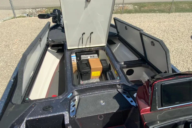 Slide: The Image of 2025 Ranger Z521R boat storage compartments open, revealing organized interior space. - 12