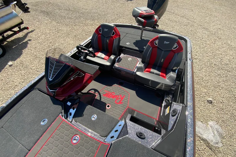 Slide: The Image of 2025 Ranger Z521R boat interior with dual seats and modern dashboard design. - 14
