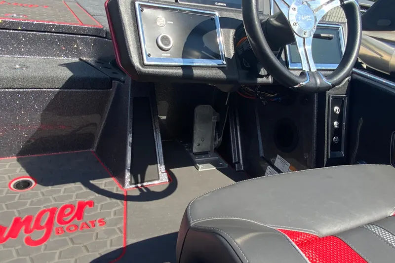 Slide: The Image of 2025 Ranger Z521R boat interior with steering wheel and control panel. - 16