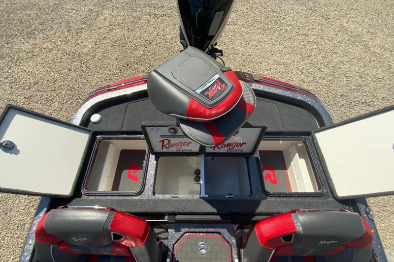 Slide: The Image of 2025 Ranger Z521R boat interior with storage compartments and seating. - 18