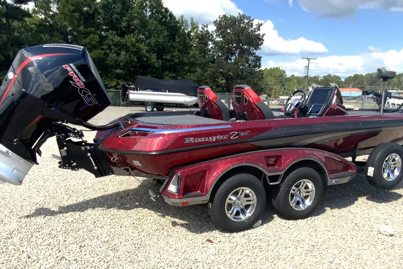 Slide: The Image of 2025 Ranger Z521R boat with powerful engine, sleek design, and vibrant red color. - 20