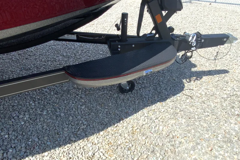 Slide: The Image of 2025 Ranger Z521R boat trailer on gravel surface, featuring a sturdy step platform. - 8