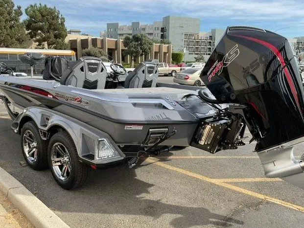 Slide: The Image of 2025 Ranger Z521R Cup-Equipped boat with powerful engine, parked in urban setting. - 4