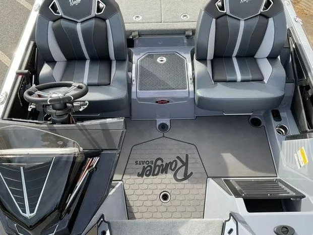 Slide: The Image of 2025 Ranger Z521R Cup-Equipped boat interior with dual seats and steering wheel. - 8