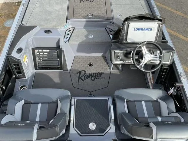 Slide: The Image of 2025 Ranger Z521R Cup-Equipped boat interior with Lowrance system and dual seating. - 9