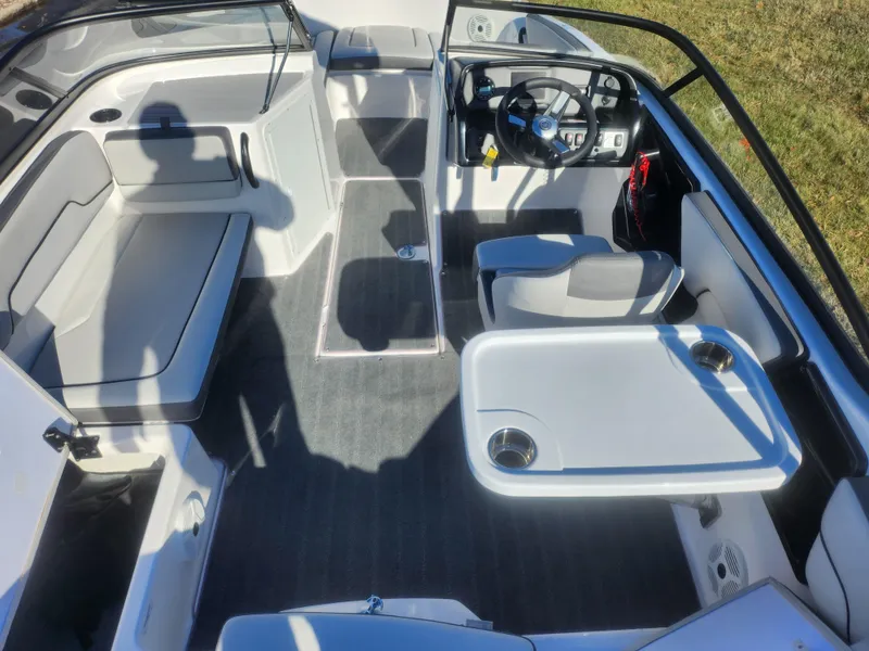 Slide: The Image of 2023 Yamaha AR190 boat interior with seating and steering wheel. - 10