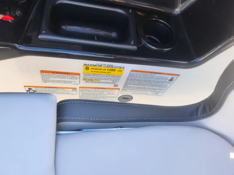 Slide: The Image of 2023 Yamaha AR190 boat interior with capacity label and seating. - 12