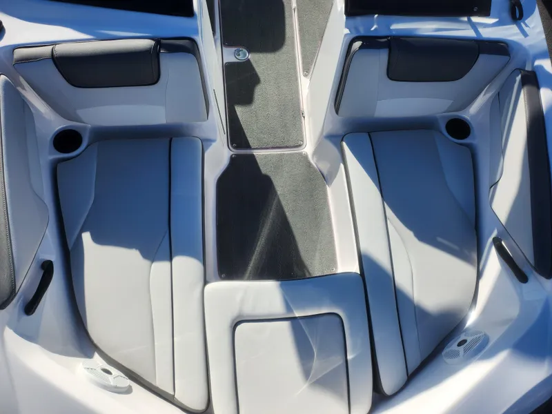 Slide: The Image of 2023 Yamaha AR190 boat interior with cushioned seating and cup holders. - 17
