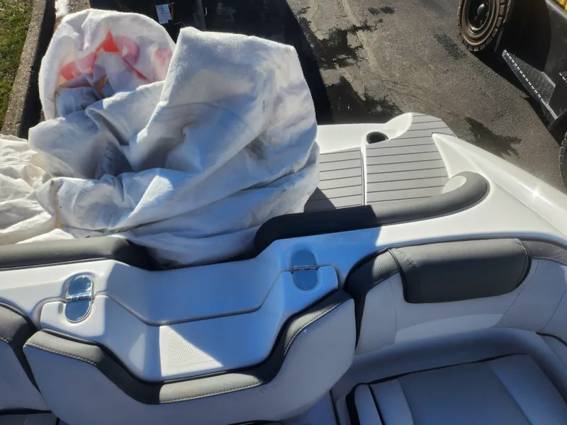 Slide: The Image of 2023 Yamaha AR190 boat interior with seating and storage area. - 21