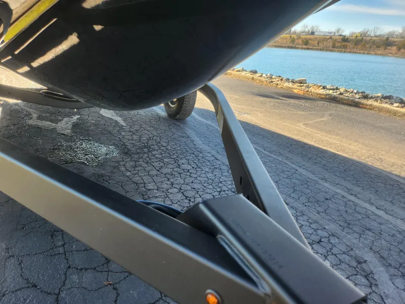 Slide: The Image of 2023 Yamaha AR190 boat trailer near a lake on a sunny day. - 7