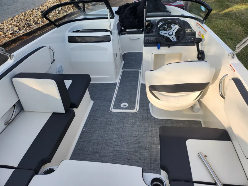 Slide: The Image of 2022 Bayliner VR4 Bowrider OB interior with seating and steering wheel. - 10
