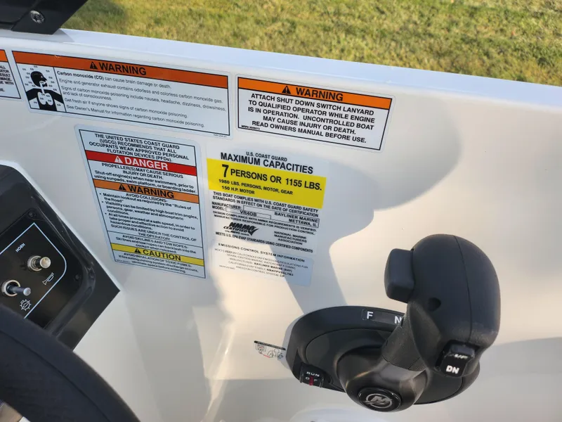 Slide: The Image of 2022 Bayliner VR4 Bowrider OB control panel with safety warnings and capacity limits. - 13
