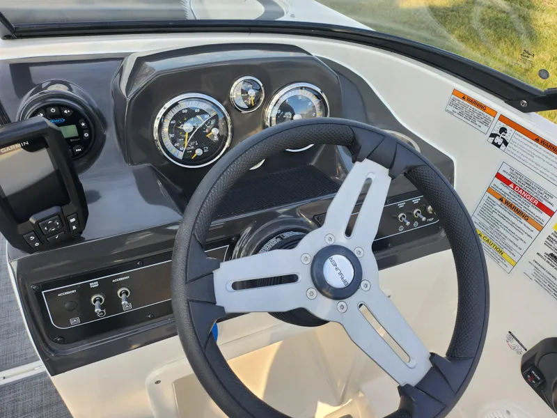 Slide: The Image of 2022 Bayliner VR4 Bowrider OB dashboard with steering wheel and gauges. - 14