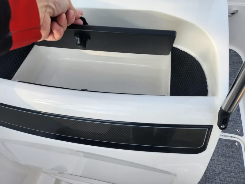 Slide: The Image of 2022 Bayliner VR4 Bowrider OB storage compartment with open lid. - 15