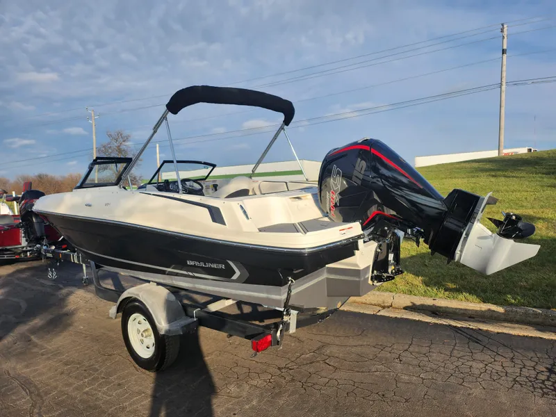 Slide: The Image of 2022 Bayliner VR4 Bowrider OB on trailer, parked outdoors under clear sky. - 3