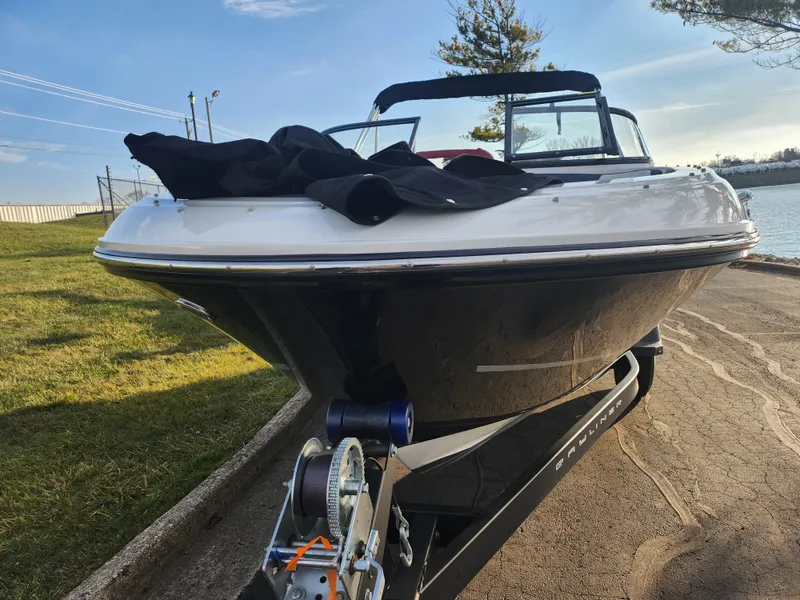 Slide: The Image of 2022 Bayliner VR4 Bowrider OB on trailer by waterfront. - 6