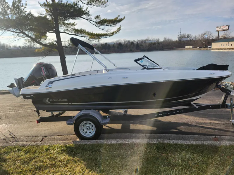 Slide: The Image of 2022 Bayliner VR4 Bowrider OB on trailer by a lake. - 9