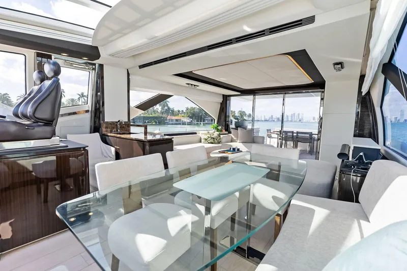 Slide: The Image of Luxurious interior of 2017 Azimut 77S yacht with modern furnishings and panoramic windows. - 15