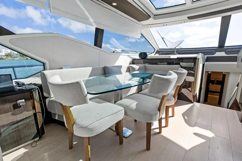 Slide: The Image of Luxurious interior of 2017 Azimut 77S yacht with elegant dining area and panoramic windows. - 16