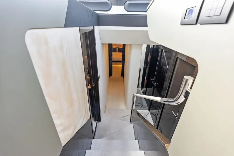 Slide: The Image of Interior staircase of 2017 Azimut 77S yacht, featuring modern design and sleek finishes. - 21