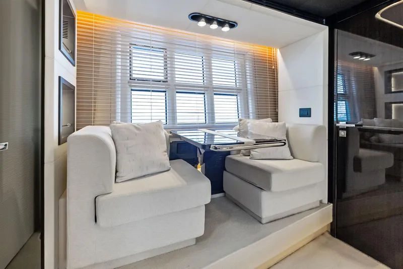 Slide: The Image of Luxurious interior seating area on a 2017 Azimut 77S yacht with modern design. - 24