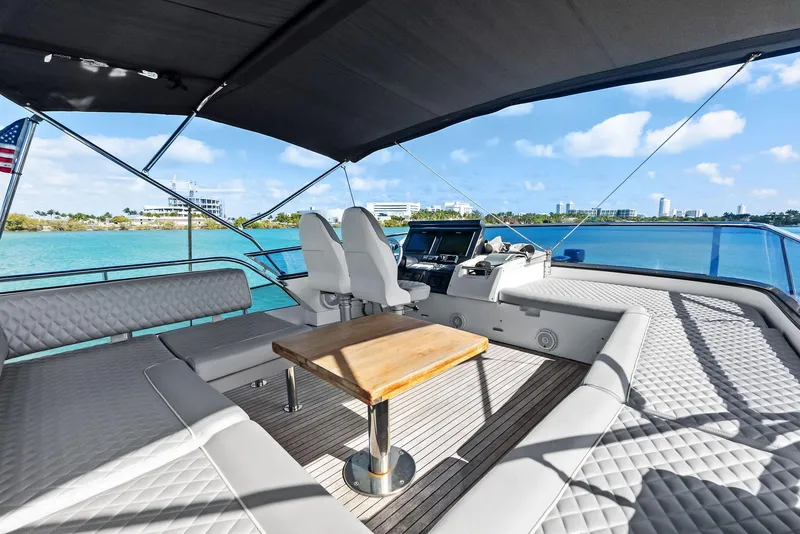 Slide: The Image of Luxury Azimut 77S yacht deck with seating, table, and ocean view, 2017 model. - 3