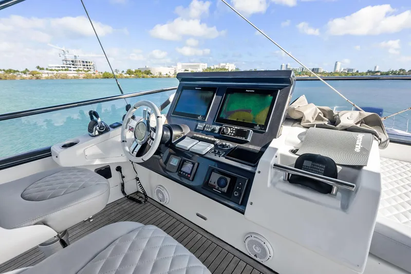 Slide: The Image of 2017 Azimut 77S yacht helm with modern navigation equipment and luxurious seating. - 4