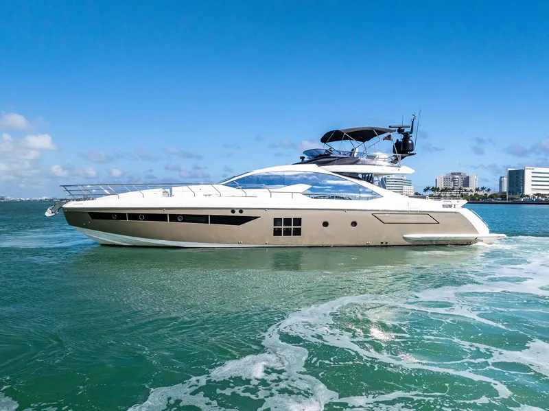 Slide: The Image of Azimut 77S 2017 yacht cruising on clear blue waters near city skyline. - 41