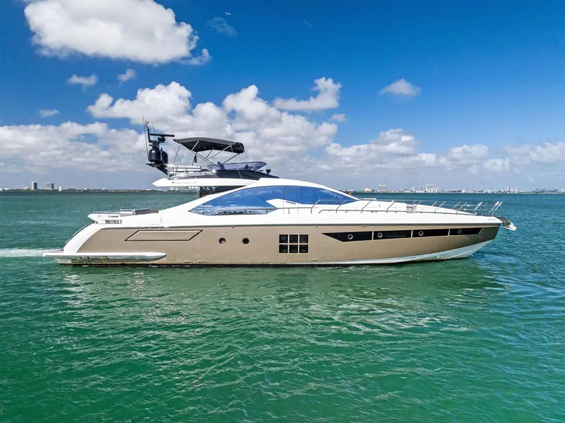 Slide: The Image of 2017 Azimut 77S yacht cruising on open water under a clear blue sky. - 42