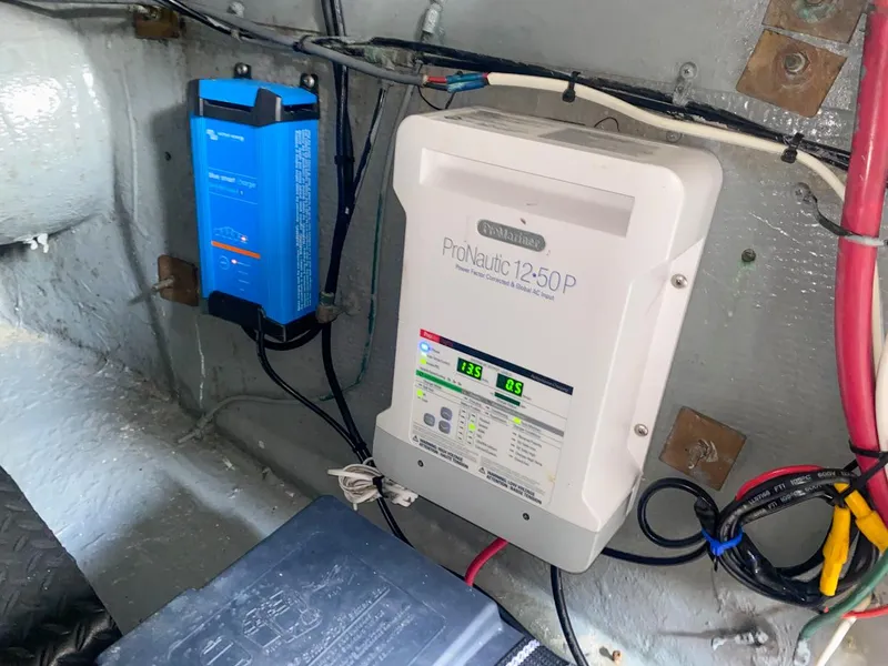 Slide: The Image of Battery charger setup in 1990 Hatteras 62 Cockpit Motor Yacht engine room. - 13