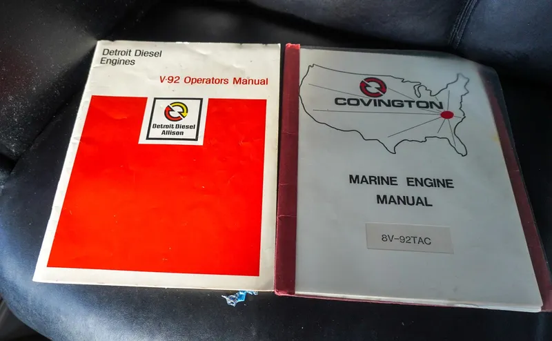 Slide: The Image of Detroit Diesel and Covington marine engine manuals on a Hatteras 62 Cockpit Motor Yacht. - 22
