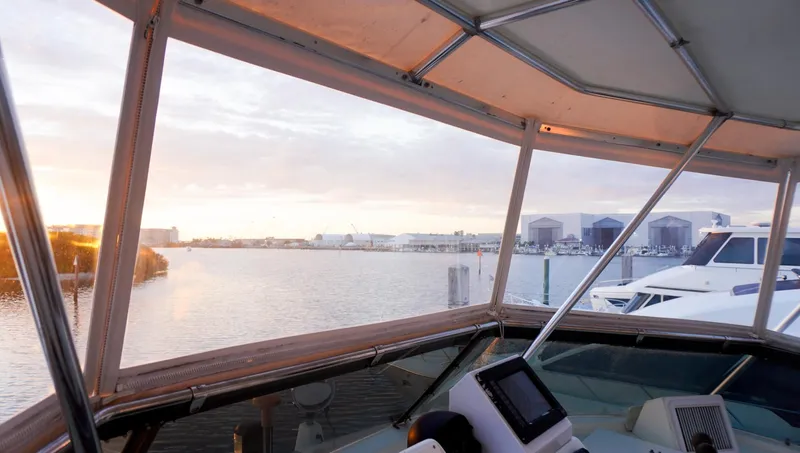 Slide: The Image of View from 1990 Hatteras 62 Cockpit Motor Yacht at sunset, overlooking marina. - 30