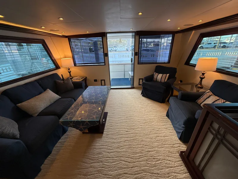 Slide: The Image of Luxurious interior of 1990 Hatteras 62 Cockpit Motor Yacht with elegant seating and decor. - 34