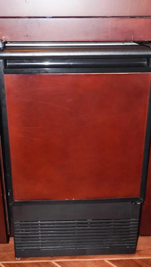 Slide: The Image of Wood-paneled appliance on 1990 Hatteras 62 Cockpit Motor Yacht interior. - 40