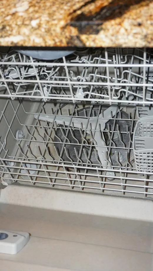 Slide: The Image of Open dishwasher with clean dishes inside, aboard a 1990 Hatteras 62 Cockpit Motor Yacht. - 41