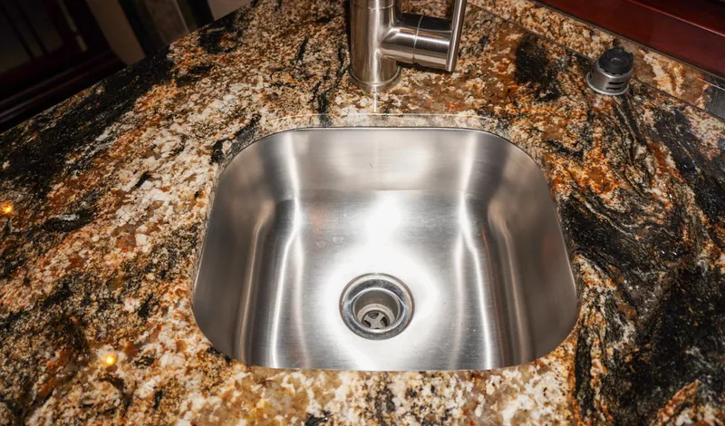 Slide: The Image of Stainless steel sink on granite countertop in 1990 Hatteras 62 Cockpit Motor Yacht. - 45