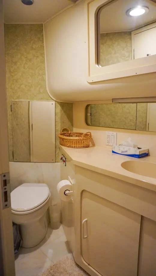 Slide: The Image of Bathroom interior of 1990 Hatteras 62 Cockpit Motor Yacht with modern amenities. - 48