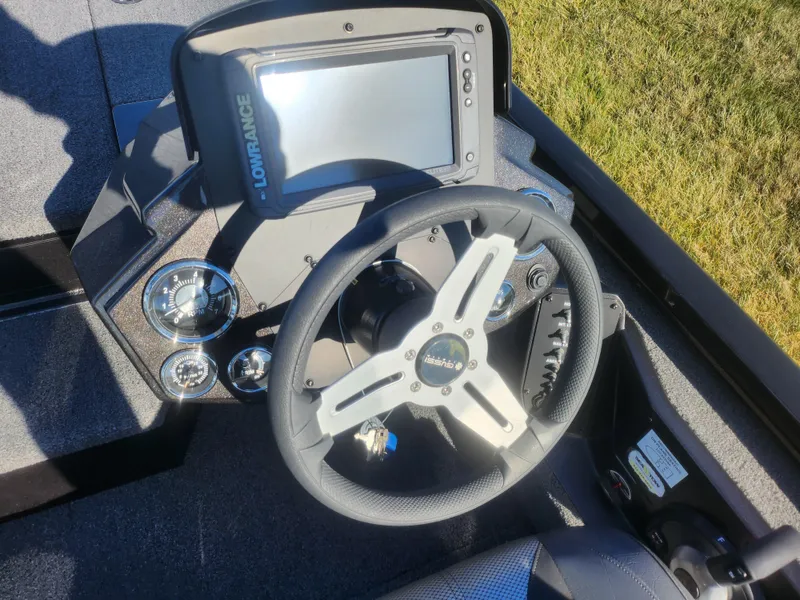 Slide: The Image of 2020 Vexus AVX1880 boat dashboard with Lowrance display and steering wheel. - 13