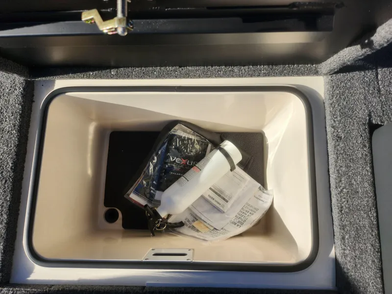 Slide: The Image of Storage compartment of 2020 Vexus AVX1880 boat with accessories and documents. - 22