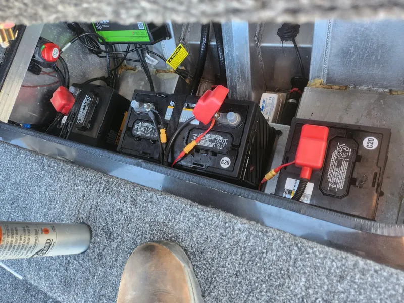Slide: The Image of 2020 Vexus AVX1880 boat battery compartment with multiple batteries and wiring. - 23