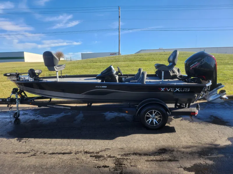Slide: The Image of 2020 Vexus AVX1880 boat on trailer, parked outdoors under clear sky. - 4