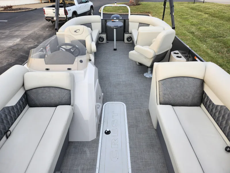 Slide: The Image of 2020 Crest Classic DLX 220 SLC pontoon boat interior with plush seating and modern design. - 11