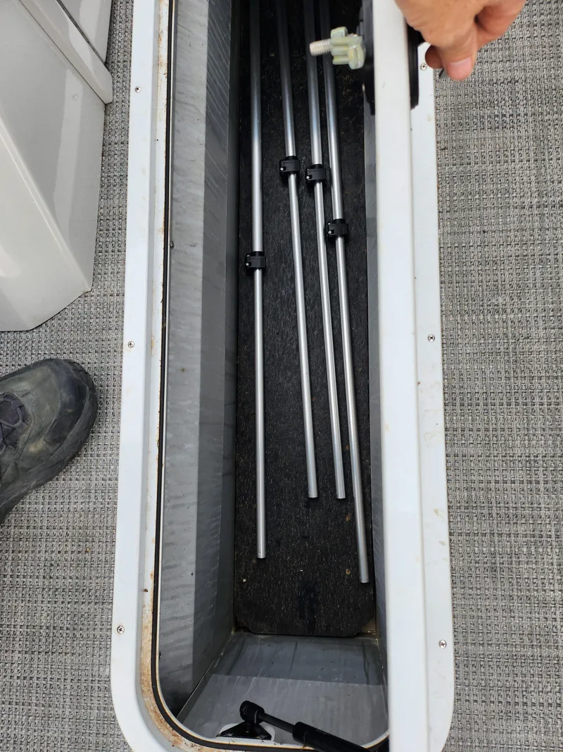 Slide: The Image of Open storage compartment in 2020 Crest Classic DLX 220 SLC boat. - 12