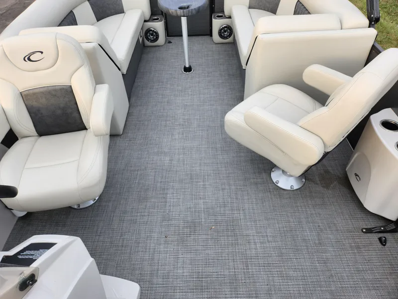 Slide: The Image of 2020 Crest Classic DLX 220 SLC boat interior with plush seating and modern design. - 13