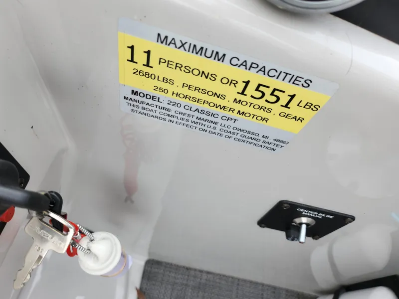 Slide: The Image of Crest Classic DLX 220 SLC 2020 boat capacity label, 11 persons or 1551 lbs. - 19