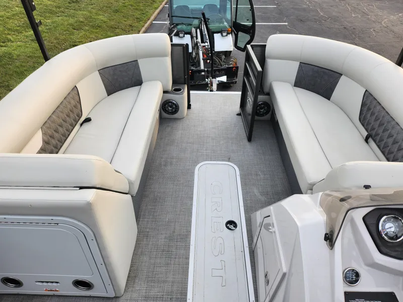 Slide: The Image of 2020 Crest Classic DLX 220 SLC pontoon boat interior with plush seating and modern design. - 21