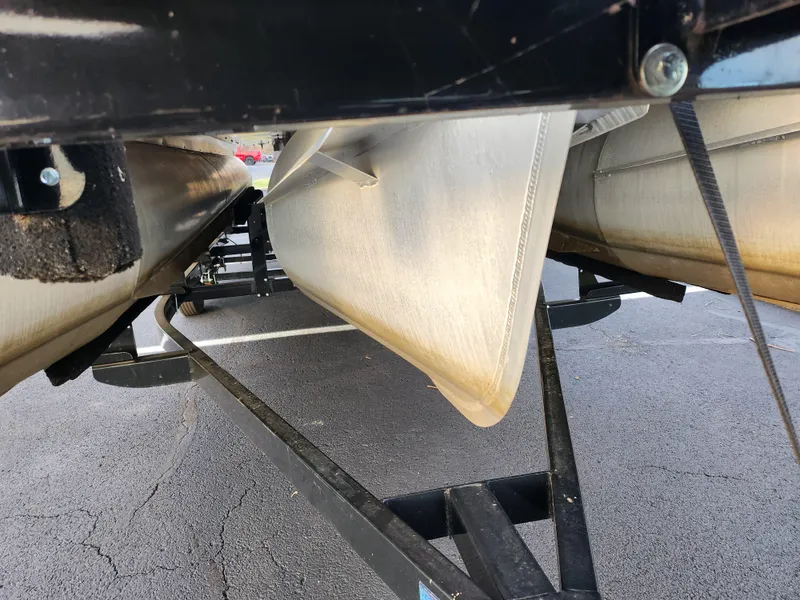 Slide: The Image of Close-up of 2020 Crest Classic DLX 220 SLC pontoon boat underside on trailer. - 7
