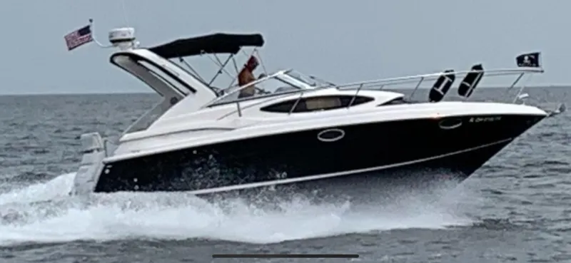 Slide: The Image of 2011 Regal 3060 Window Express cruising on open water. - 10